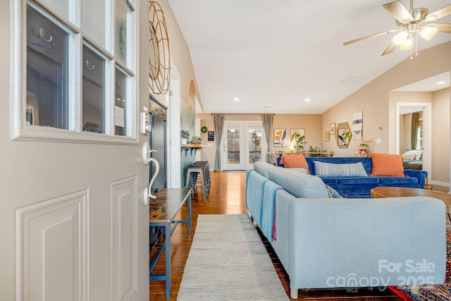 living room featuring french doors, recessed lighting, ceiling fan, vaulted ceiling, and wood finished floors