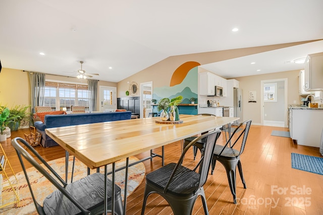 dining space with lofted ceiling, ceiling fan, recessed lighting, baseboards, and light wood-style floors