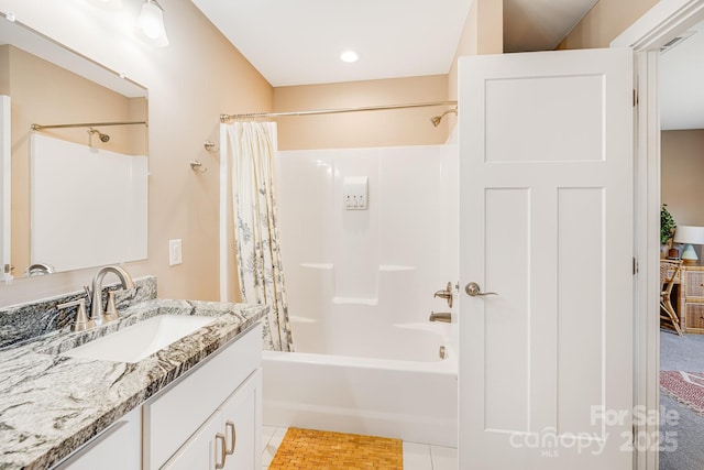 full bath featuring shower / bath combo, vanity, and tile patterned floors