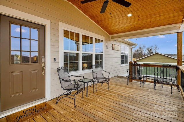 wooden terrace featuring ceiling fan