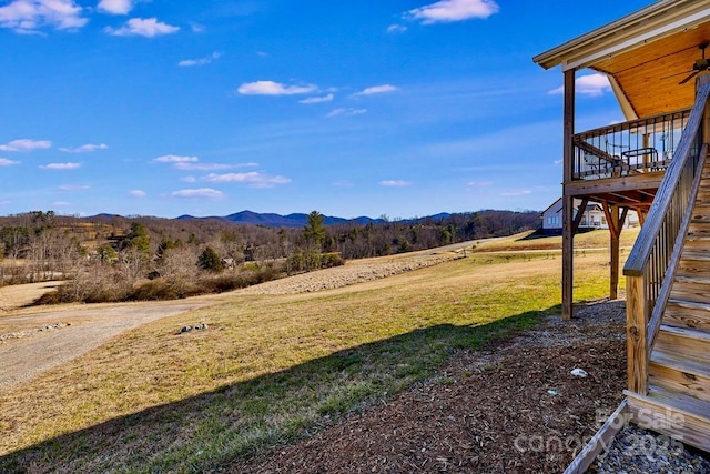 view of yard with stairway and a mountain view