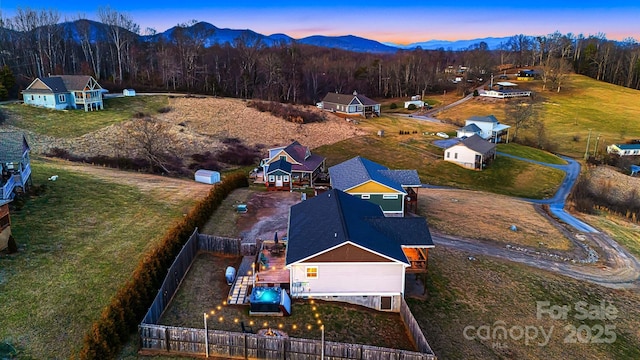 bird's eye view with a mountain view and a forest view