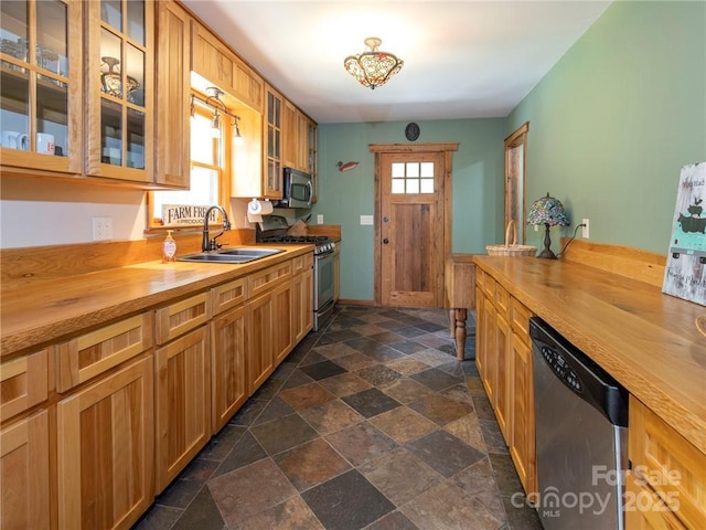 167 Bold Springs Rd, Sylva, NC 28779 - kitchen featuring a sink, butcher block countertops, stone tile flooring, and stainless steel appliances