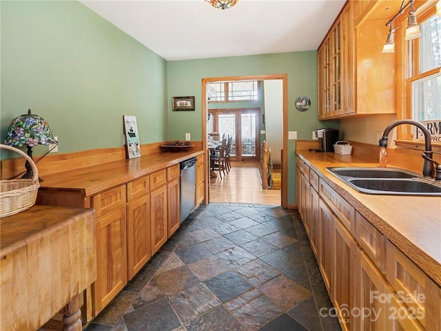 167 Bold Springs Rd, Sylva, NC 28779 - kitchen with glass insert cabinets, dishwasher, a sink, and stone tile flooring