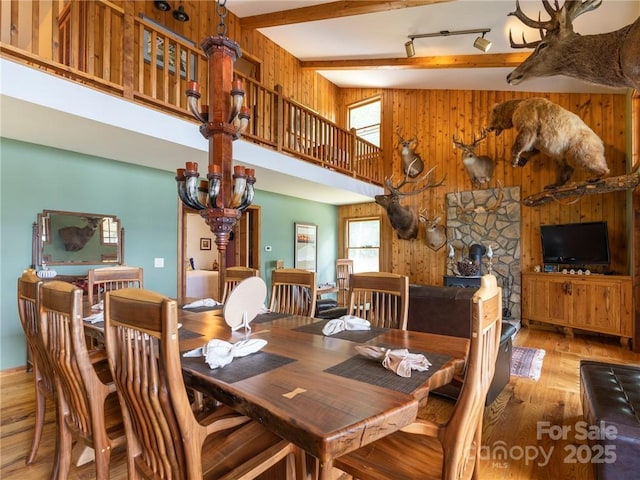 167 Bold Springs Rd, Sylva, NC 28779 - dining area with wood walls, hardwood / wood-style flooring, and beamed ceiling