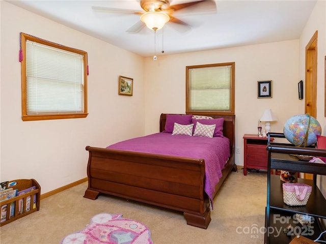 167 Bold Springs Rd, Sylva, NC 28779 - bedroom with baseboards, a ceiling fan, and light carpet