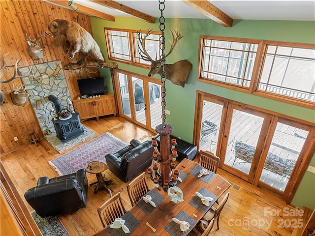 167 Bold Springs Rd, Sylva, NC 28779 - living room with french doors, a high ceiling, a wood stove, beamed ceiling, and wood finished floors