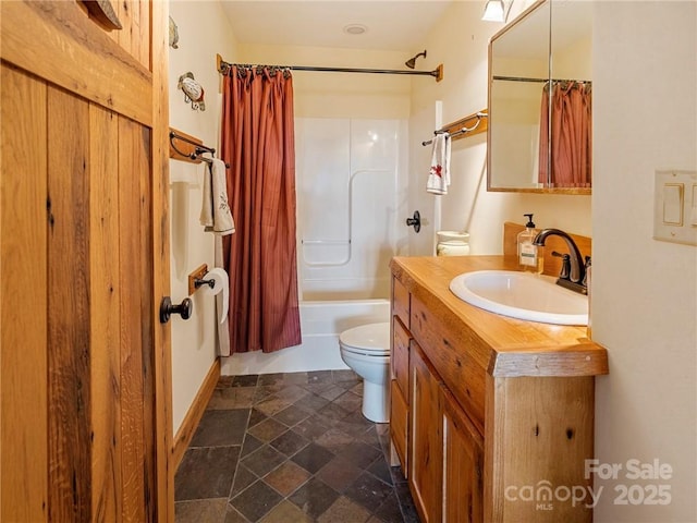 167 Bold Springs Rd, Sylva, NC 28779 - bathroom with toilet, stone finish floor, vanity, and shower / bath combo with shower curtain