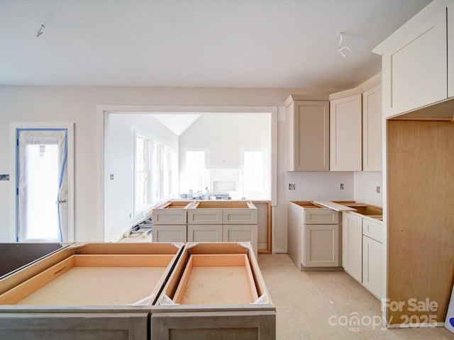 kitchen with white cabinetry and a kitchen island