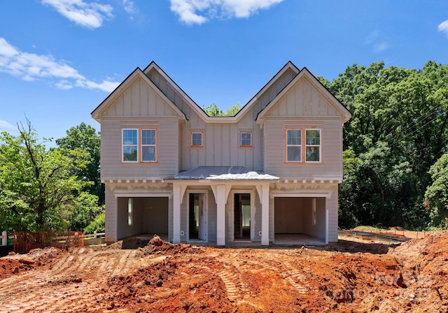 modern farmhouse style home featuring board and batten siding and an attached garage