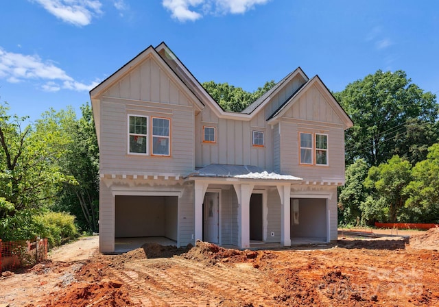 view of front of property with board and batten siding and an attached garage