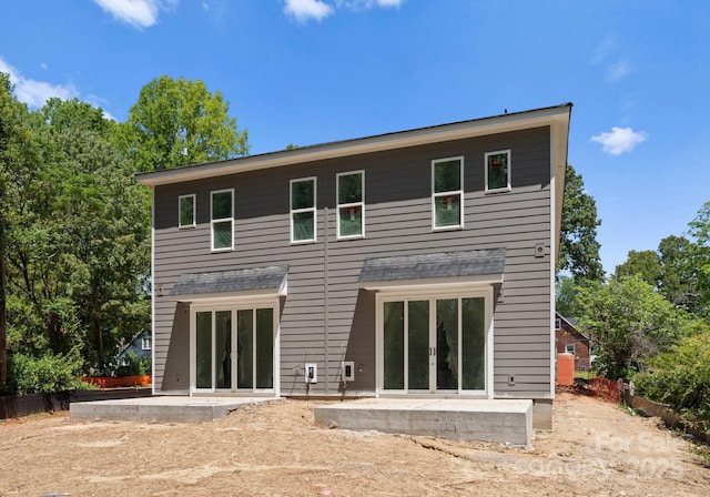 back of house with a patio