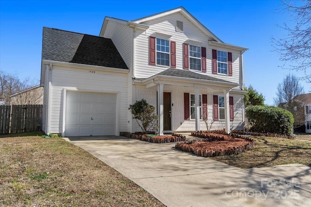 traditional home featuring a porch, an attached garage, a shingled roof, fence, and concrete driveway