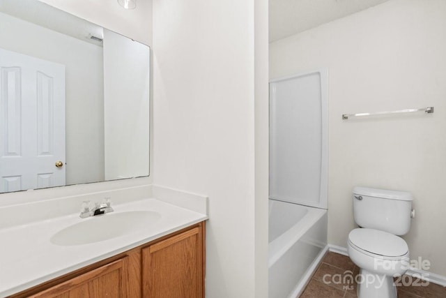 bathroom featuring bathtub / shower combination, vanity, toilet, and tile patterned floors