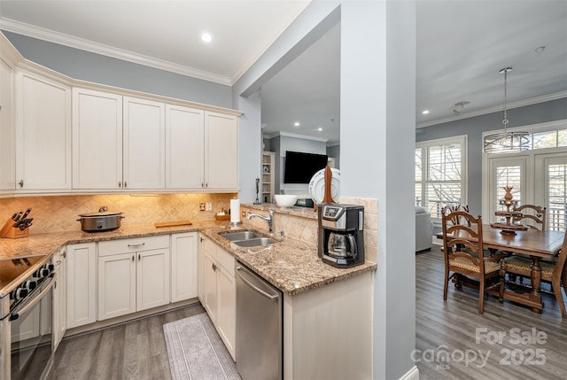 kitchen with a sink, ornamental molding, appliances with stainless steel finishes, light wood-type flooring, and light stone countertops