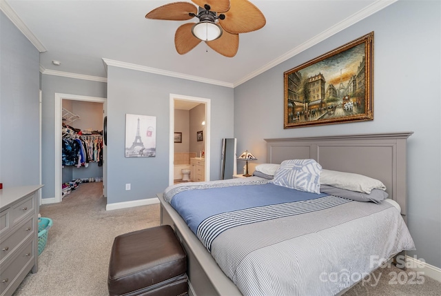 bedroom featuring a walk in closet, light colored carpet, ensuite bath, and baseboards