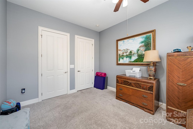 bedroom featuring carpet, a ceiling fan, and baseboards