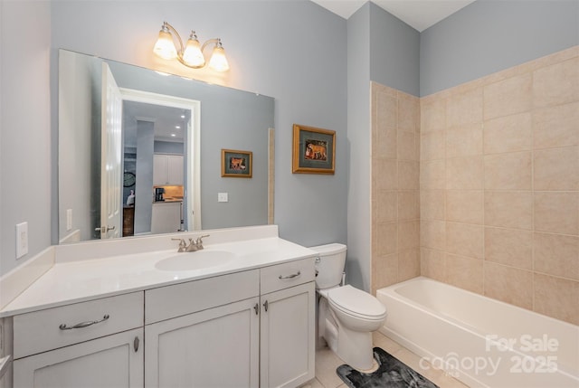 bathroom featuring tile patterned flooring, vanity, and toilet