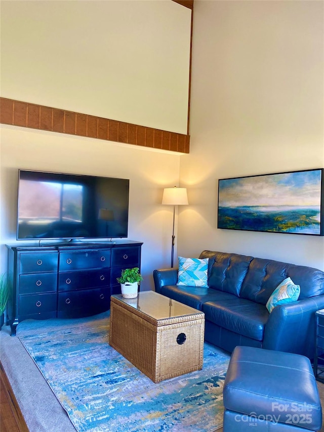 living room with a towering ceiling