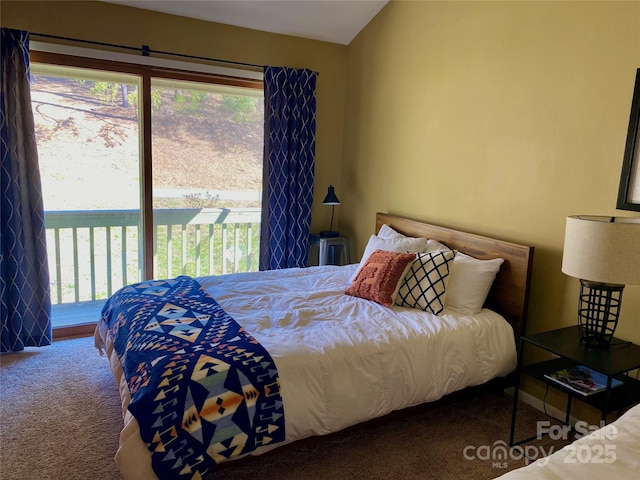 bedroom with multiple windows, access to outside, carpet flooring, and vaulted ceiling