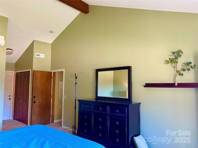 carpeted bedroom featuring a closet, visible vents, beamed ceiling, and high vaulted ceiling