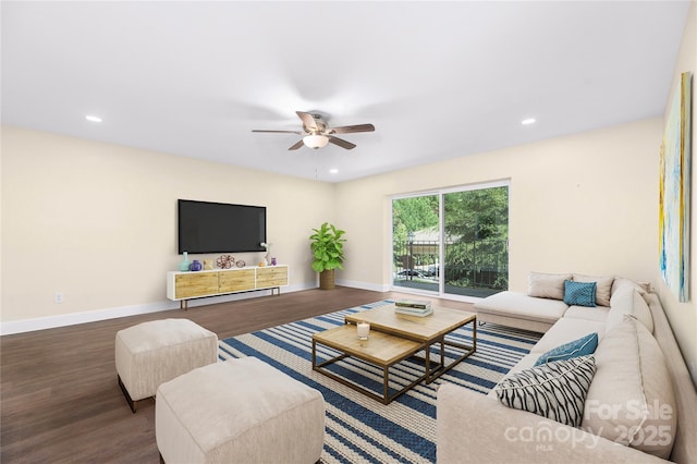 living area with recessed lighting, baseboards, and wood finished floors