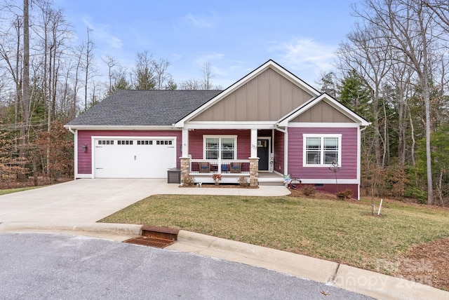 craftsman-style house featuring board and batten siding, a front lawn, a porch, crawl space, and driveway