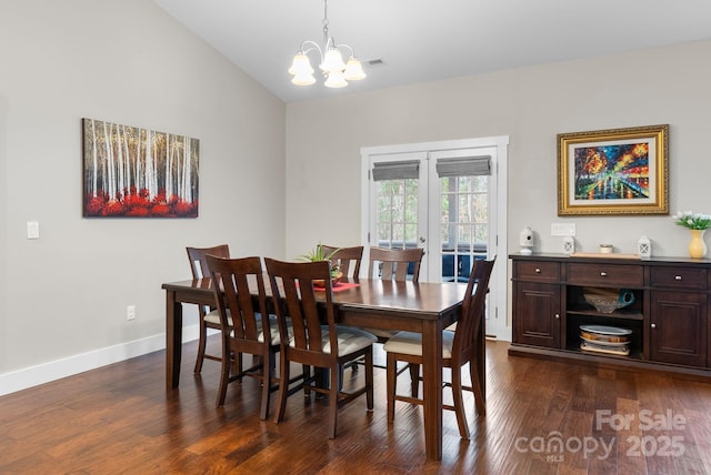 dining space featuring dark wood finished floors, vaulted ceiling, french doors, and baseboards