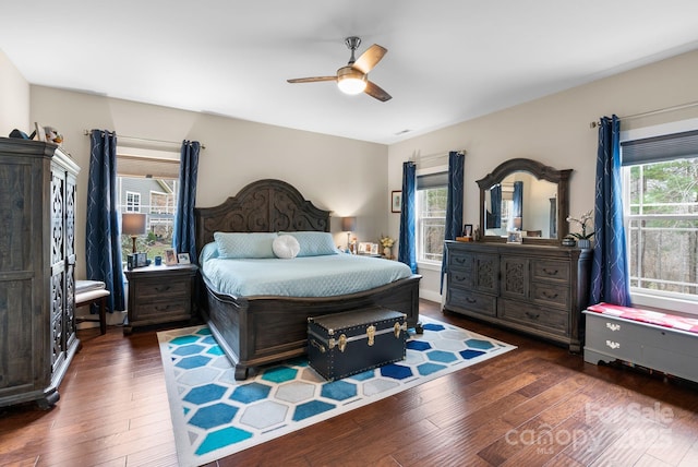 bedroom featuring hardwood / wood-style floors and a ceiling fan