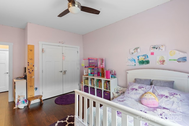 bedroom with ceiling fan, a closet, and wood finished floors