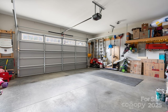 garage with electric panel and a garage door opener