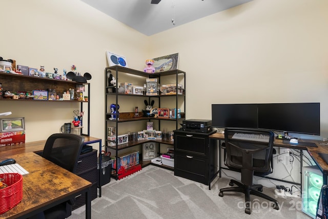 office with carpet and a ceiling fan