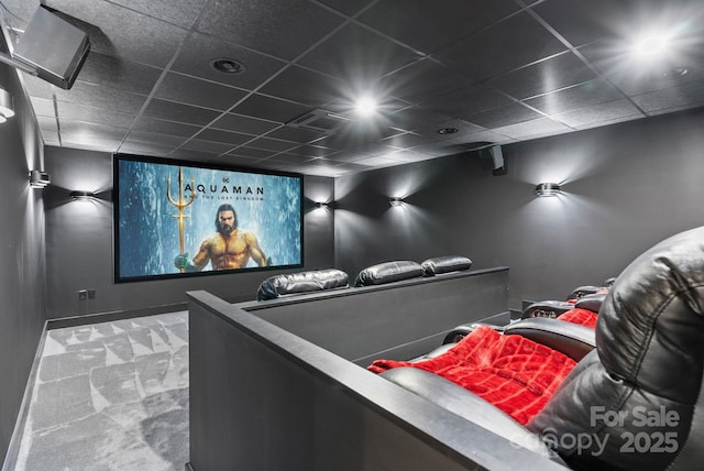 home theater featuring a drop ceiling, visible vents, and carpet floors