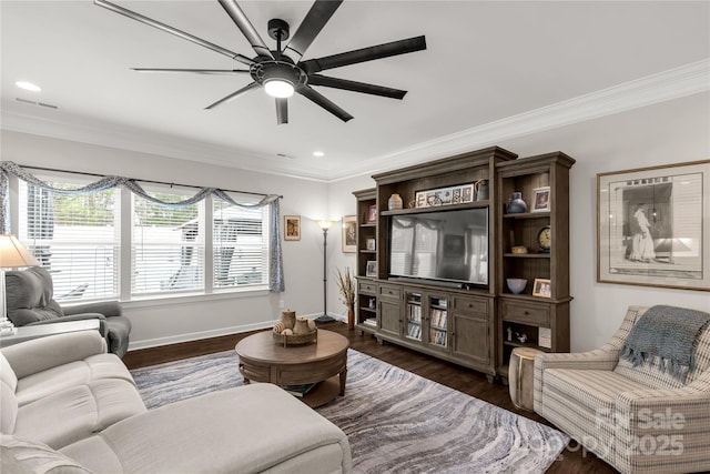 living area featuring a ceiling fan, baseboards, dark wood-type flooring, and ornamental molding