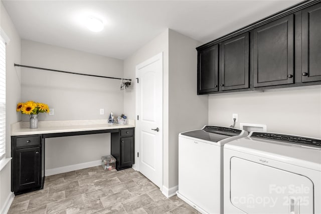 laundry room with cabinet space, baseboards, and washing machine and clothes dryer