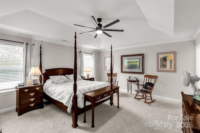 bedroom featuring light carpet, baseboards, and a raised ceiling