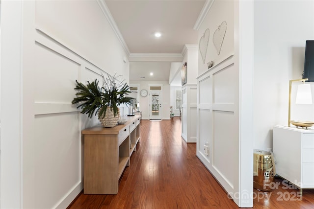 corridor with dark wood-style floors, recessed lighting, baseboards, and crown molding