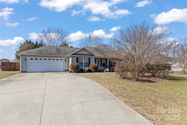 ranch-style house with a garage, driveway, a front lawn, and fence