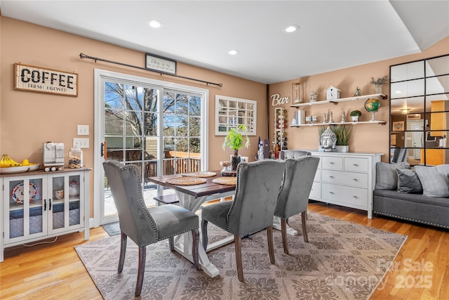 dining space featuring light wood finished floors and recessed lighting