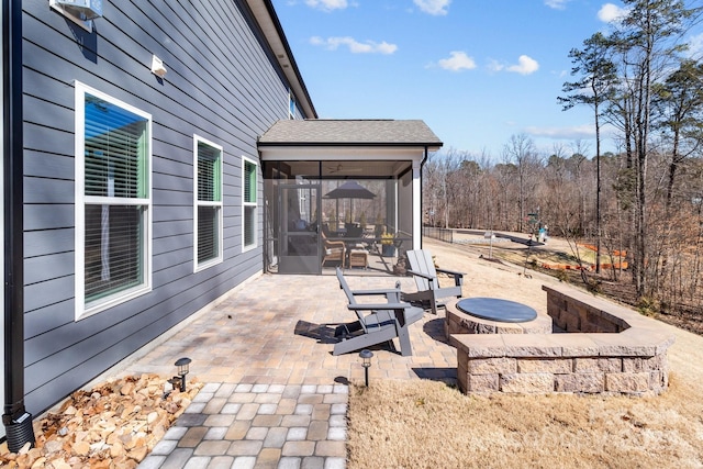 view of patio with a sunroom