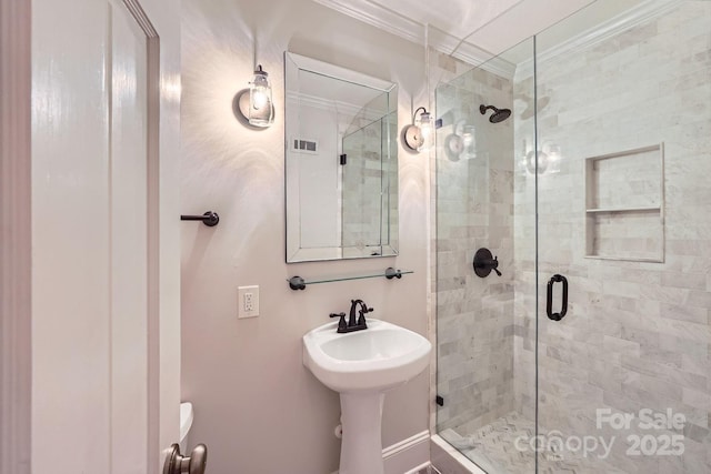 full bathroom with a stall shower and ornamental molding