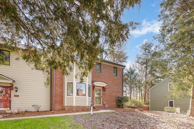 view of front of house featuring brick siding