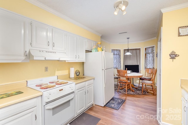 kitchen with light countertops, white appliances, white cabinets, and under cabinet range hood