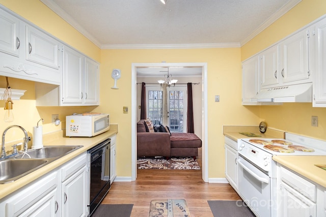 kitchen with light countertops, white appliances, white cabinetry, and under cabinet range hood