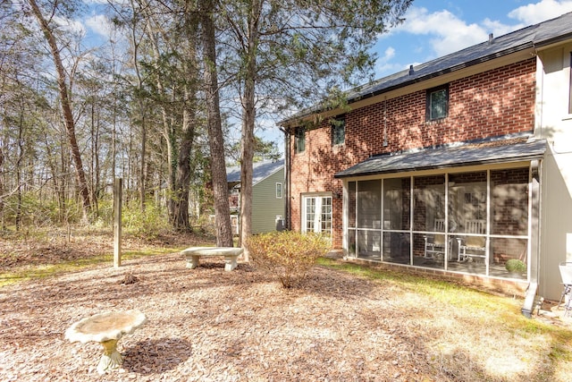 view of yard featuring a sunroom