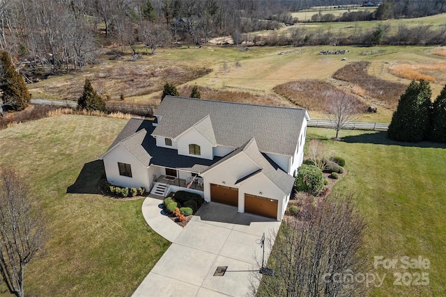 birds eye view of property featuring a rural view