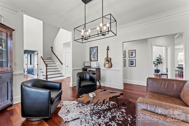 living room featuring ornamental molding, stairway, dark wood finished floors, and baseboards