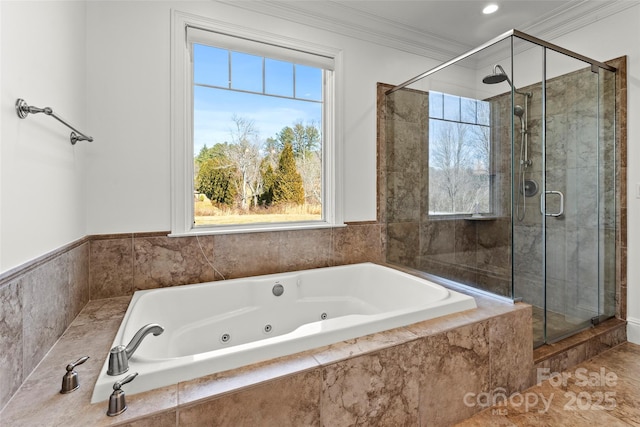 full bath featuring a stall shower, a tub with jets, and crown molding