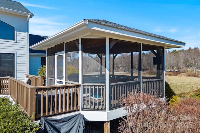 wooden deck featuring a sunroom