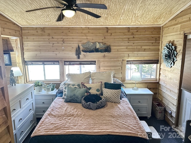 bedroom with wood ceiling, vaulted ceiling, wooden walls, and ceiling fan